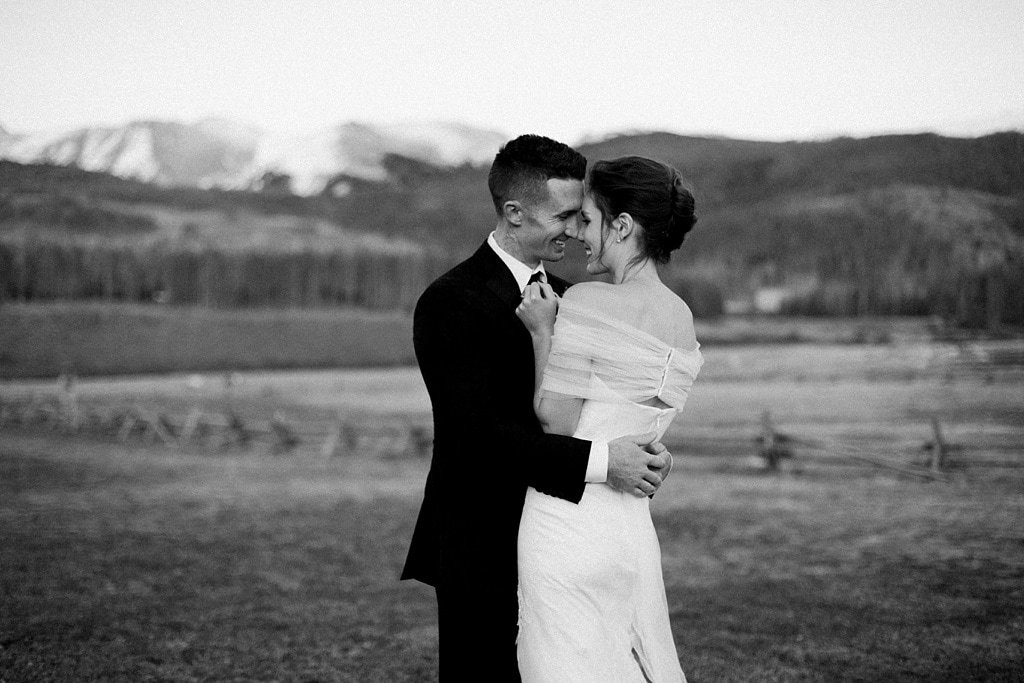 Bride and groom portraits at sunset at Devil's Thumb Ranch in Tabernash Colorado, classic photojournalistic wedding photography, Vera Wang dress, alpenglow