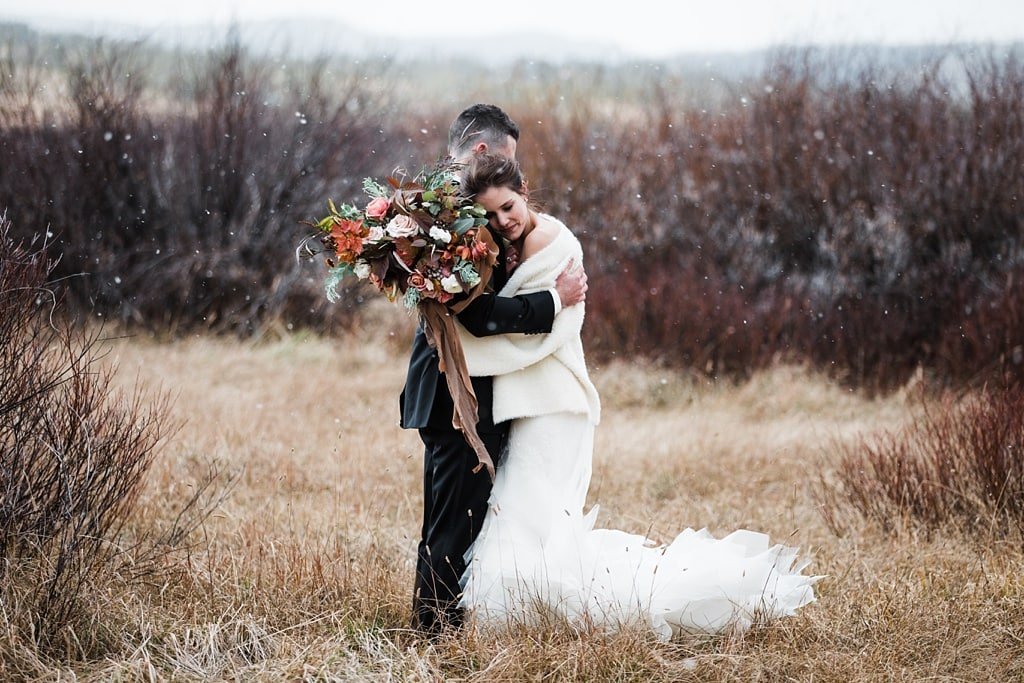 Bride and groom portraits in winter with Vera Wang wedding dress and bouquet by Yonder House