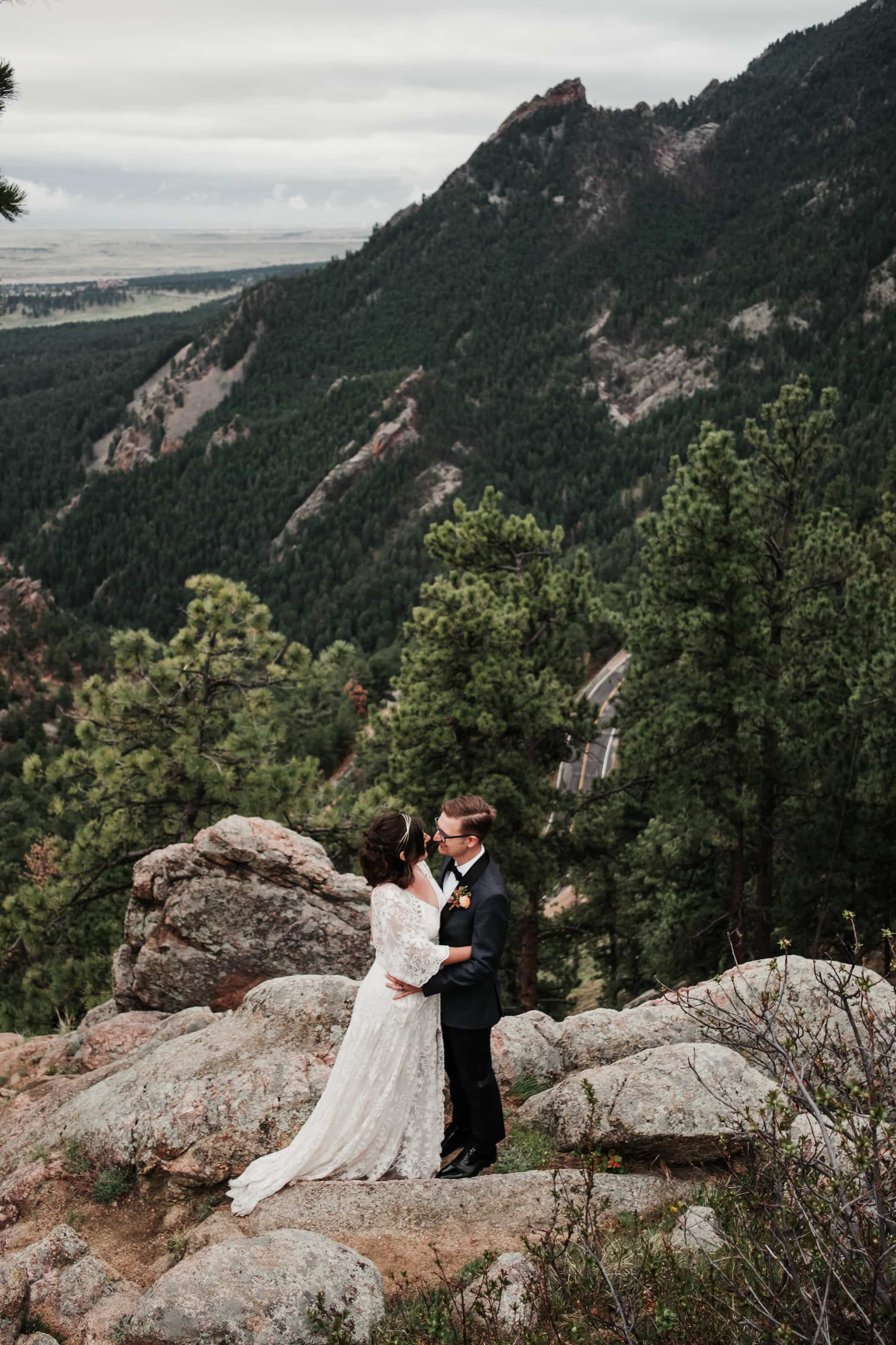 Hiking elopement photography, bride and groom hiking a mountain, Colorado wedding photographer
