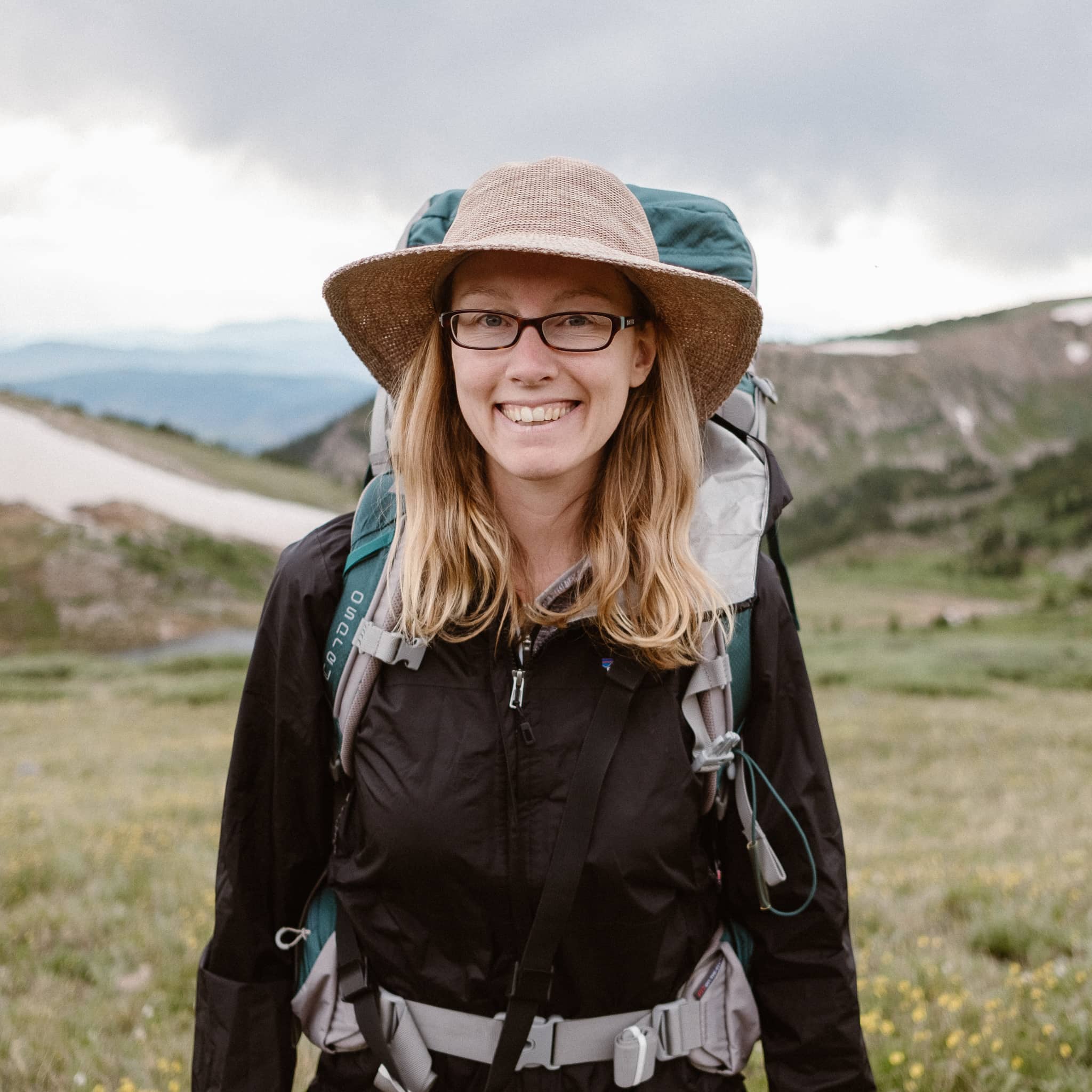 About Nina Larsen Reed and Larsen Photo Co., woman backpacking