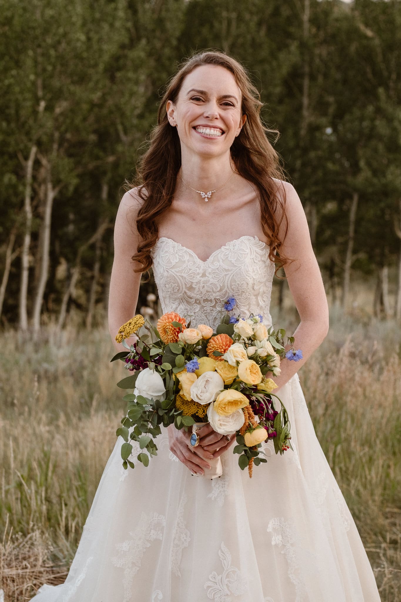 Red Feather Lakes elopement photographer, Colorado intimate cabin wedding, bride portrait with bouquet by Lace & Lilies