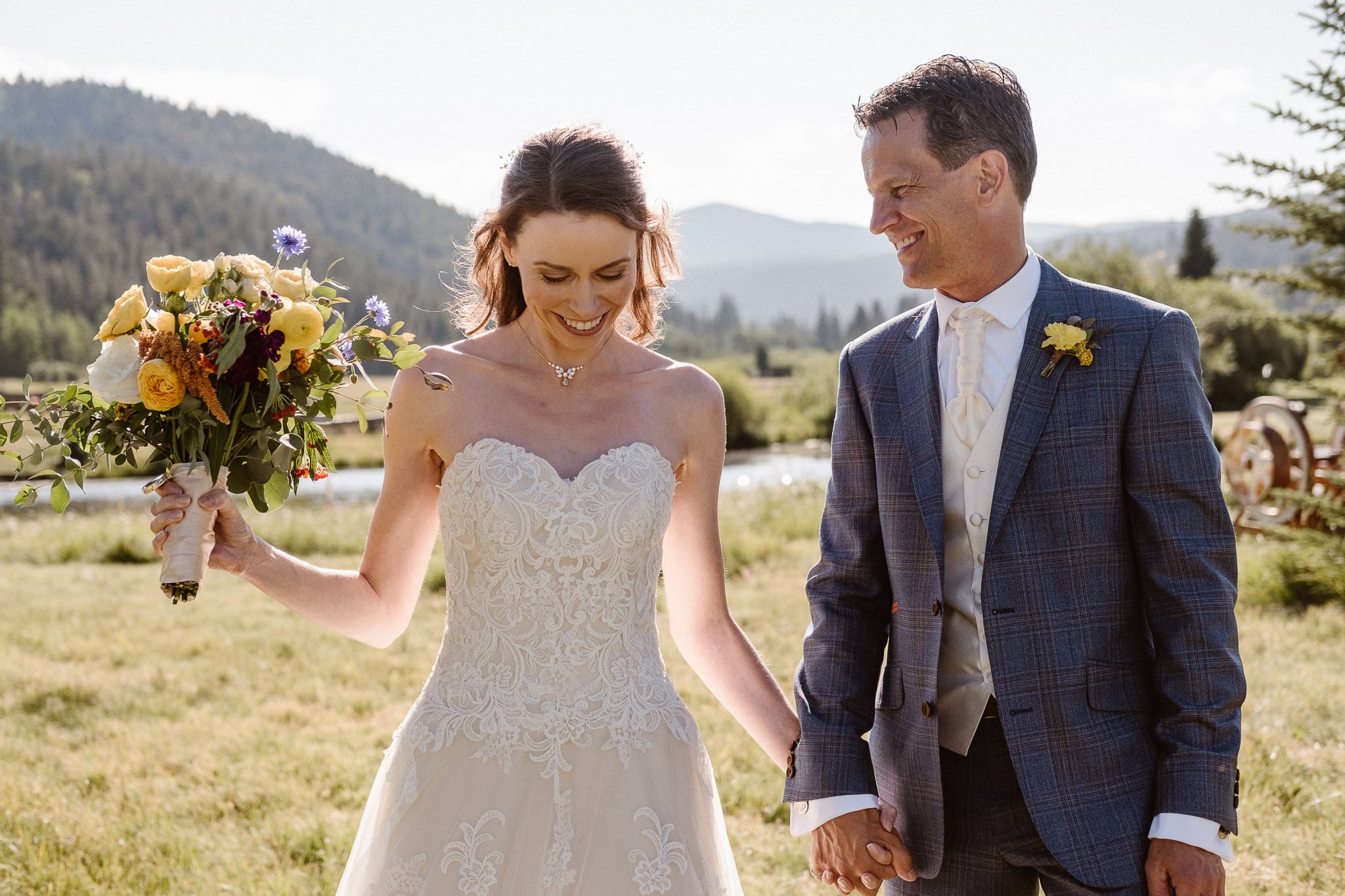 Red Feather Lakes elopement photographer, Colorado intimate cabin wedding, bride and groom portraits in mountain meadow, candid wedding portraits