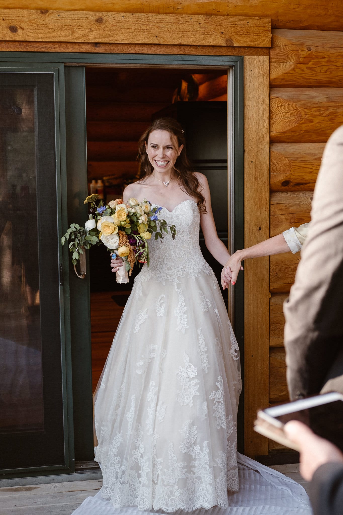 Red Feather Lakes elopement photographer, Colorado intimate cabin wedding, bride walking down stairs