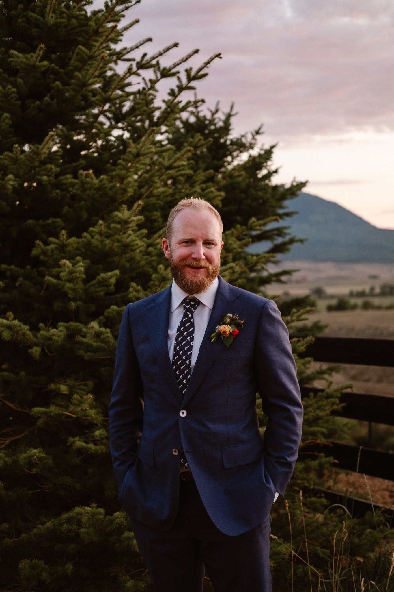 Steamboat Springs wedding photographer, La Joya Dulce wedding, Colorado ranch wedding venues, groom portrait, groom in dark blue dress, groom with fish tie