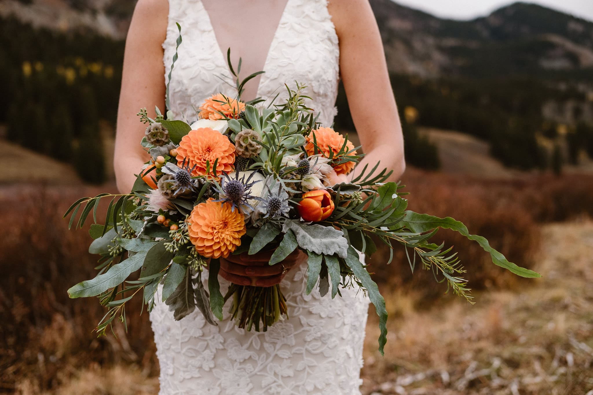 Crested Butte Wedding Photographer, Scarp Ridge Lodge intimate elopement, self solemnized elopement in Colorado, bride and groom portraits, Colorado mountain adventure wedding, bride wearing floral crown, fall color bouquet with orange flowers by From the Ground Up, wedding bouquet