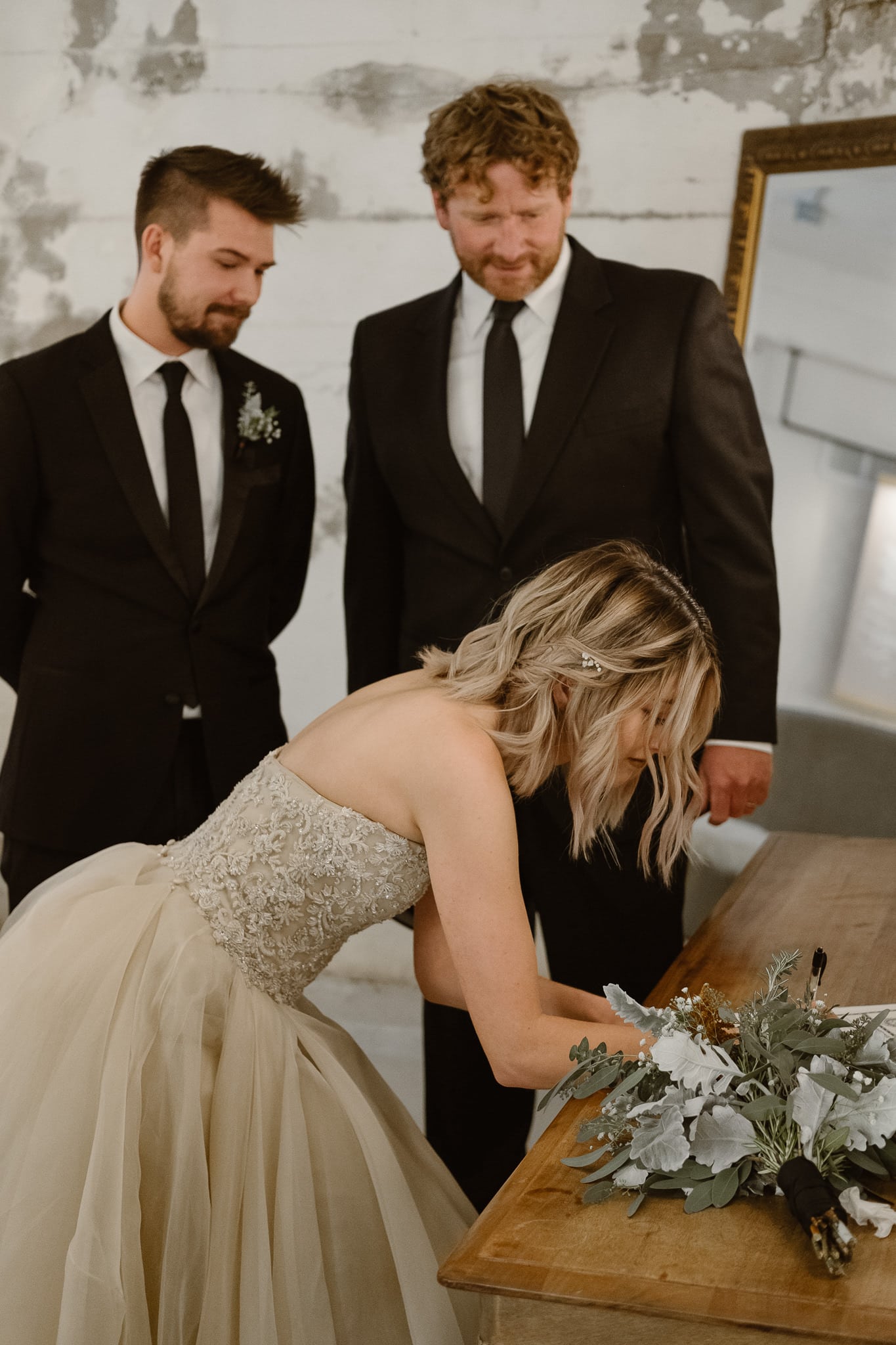 St Vrain Wedding Photographer | Longmont Wedding Photographer | Colorado Winter Wedding Photographer, Colorado industrial chic wedding ceremony, bride and groom signing marriage license