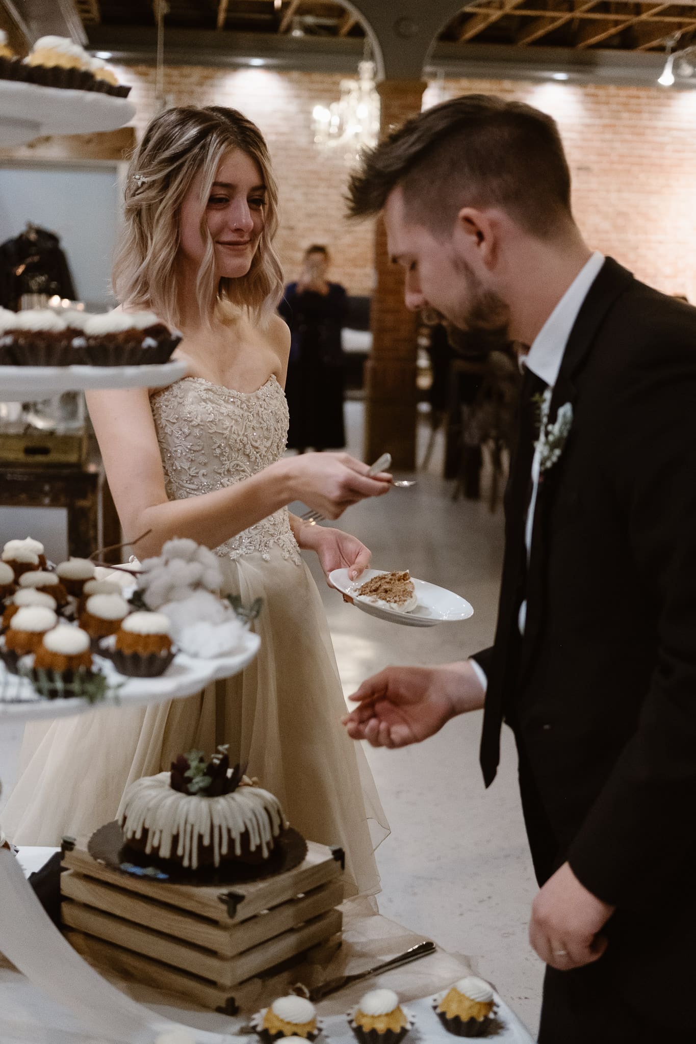St Vrain Wedding Photographer | Longmont Wedding Photographer | Colorado Winter Wedding Photographer, Colorado industrial chic wedding ceremony, bride and groom cutting bundt cake