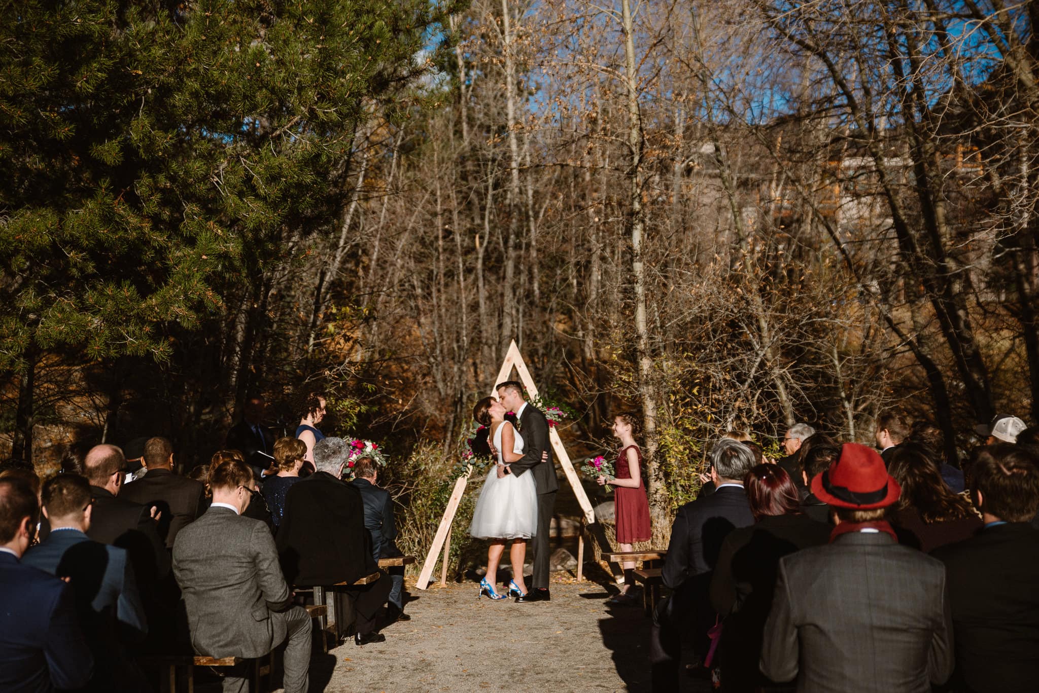 Silverthorne Pavilion wedding ceremony, Colorado wedding photographer, outdoor wedding ceremony, Colorado mountain wedding venues, bride and groom first kiss