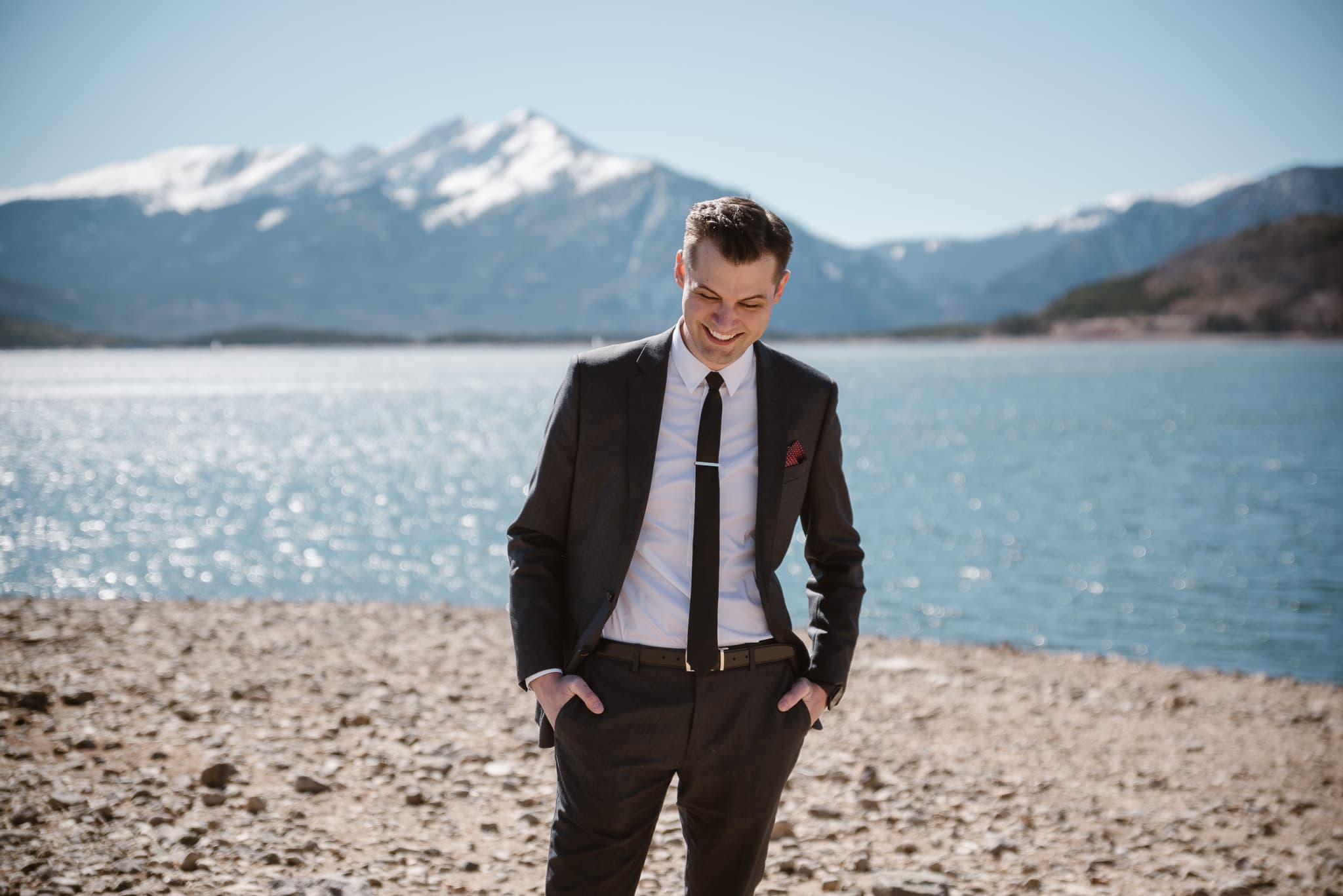 Groom portraits at Lake Dillon in Summit County for Silverthorne Pavilion wedding, Colorado wedding photographer