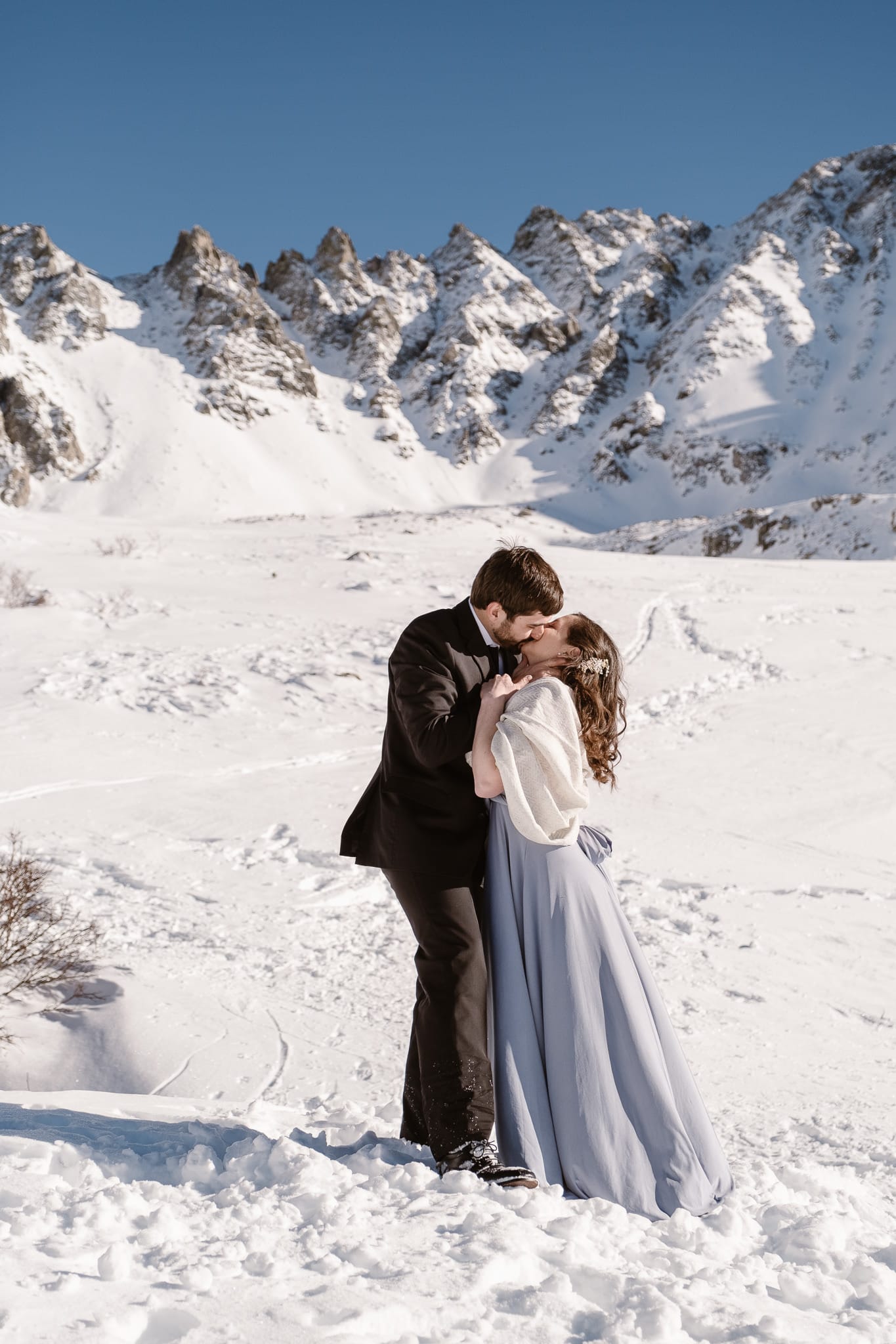 Bride and groom kissing, winter mountain elopement, Colorado ski wedding, backcountry skiing elopement
