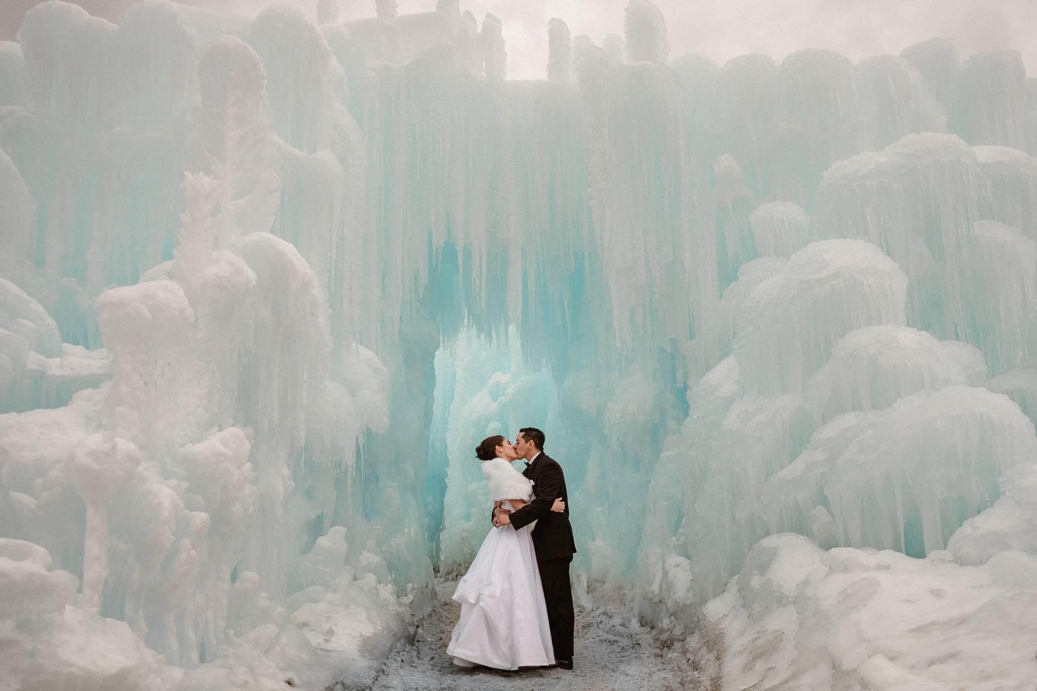 Ice Castles wedding photography, Dillon Colorado winter elopement, bride and groom inside ice castle