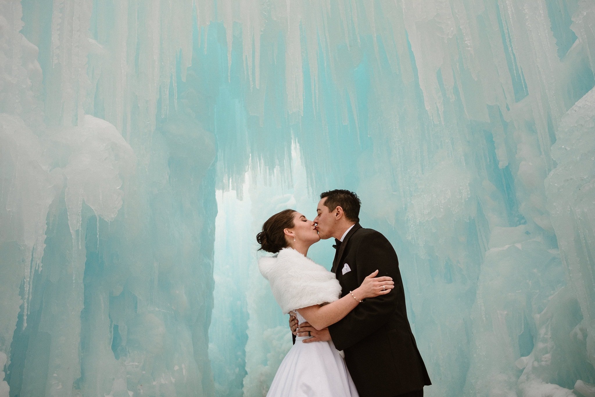 Ice Castles wedding photography, Dillon Colorado winter elopement, bride and groom inside ice castle