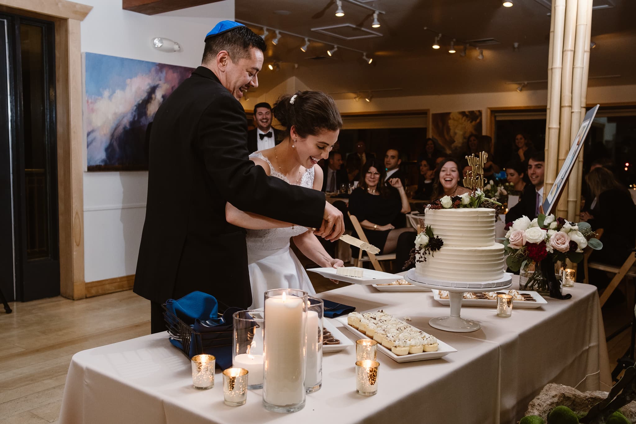 Rembrandt Yard wedding photographer, Boulder wedding photographer, Colorado Jewish wedding, bride and groom cake cutting