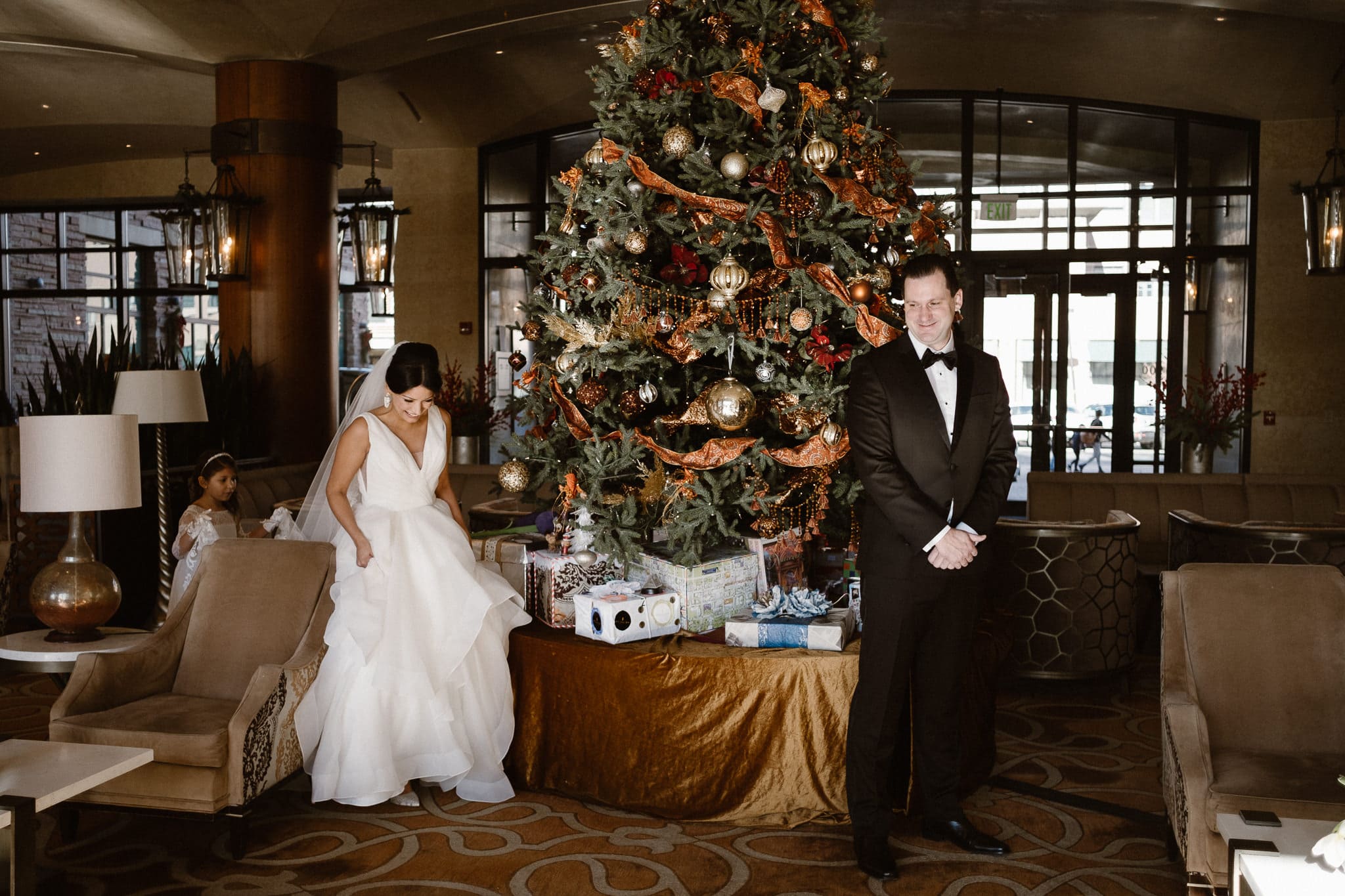 Bride and groom first look in front of giant Christmas tree at The St Julien Hotel & Spa in Boulder, St Julien wedding photographer