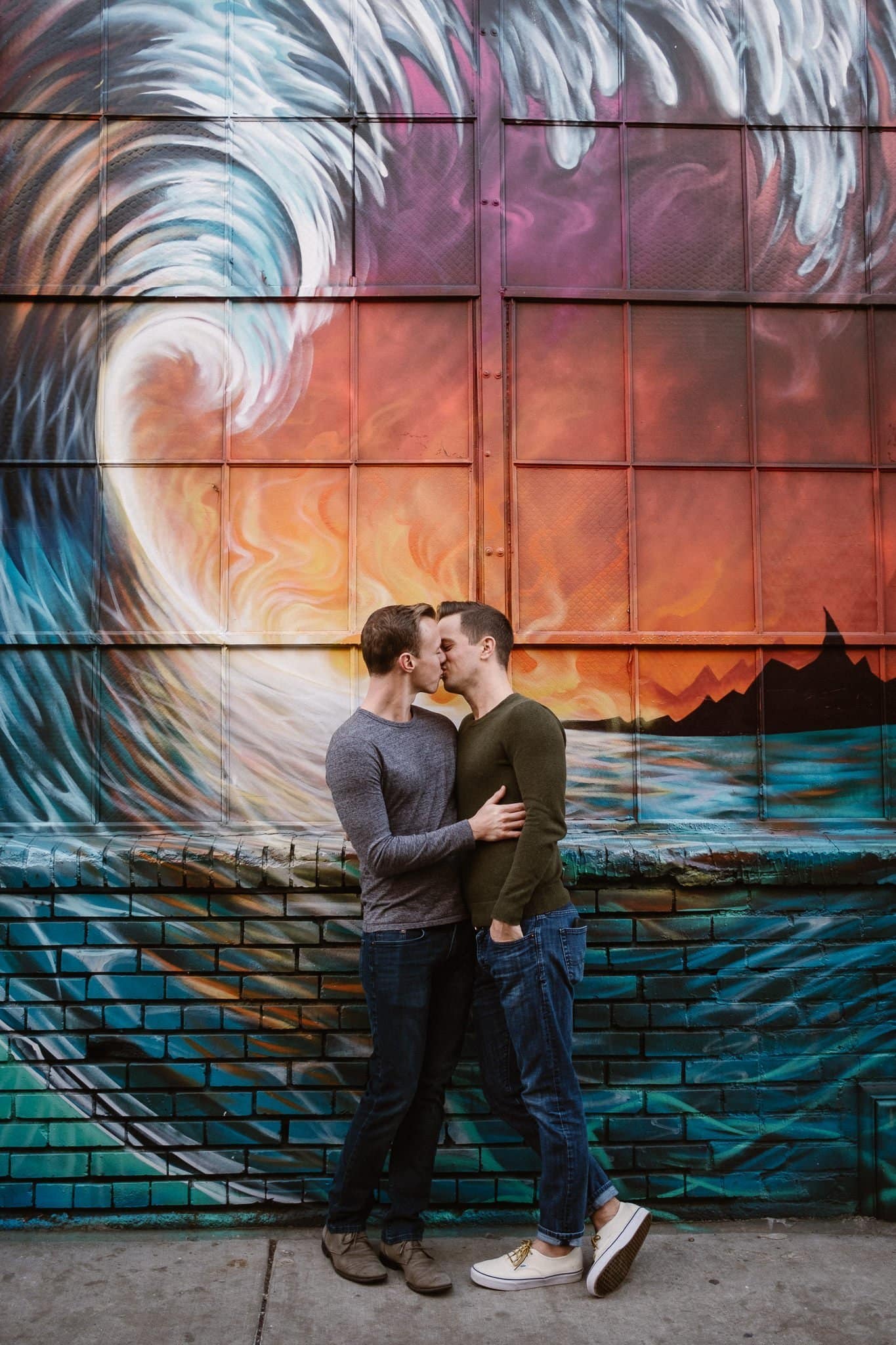 Gay couple in front of street art in RiNo neighborhood of Denver, gay engagement session, Colorado LGBT wedding photographer