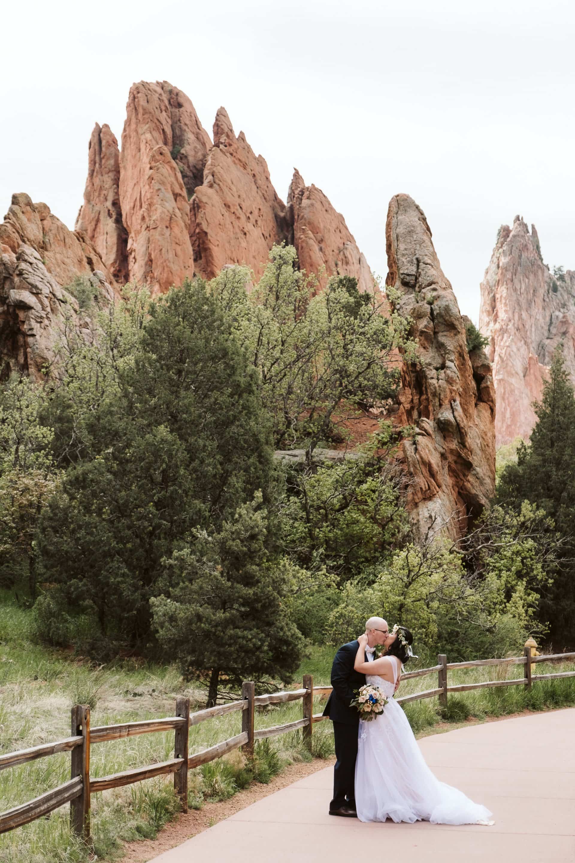 Bride and groom hiking along the trails of Garden of the Gods in Colorado Springs, Colorado elopement photographer