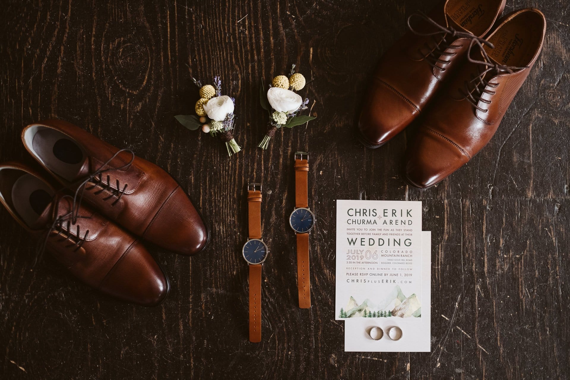 Wedding details with matching leather shoes, leather watches, boutonnieres, and wedding invitations. Gay wedding at Colorado Mountain Ranch