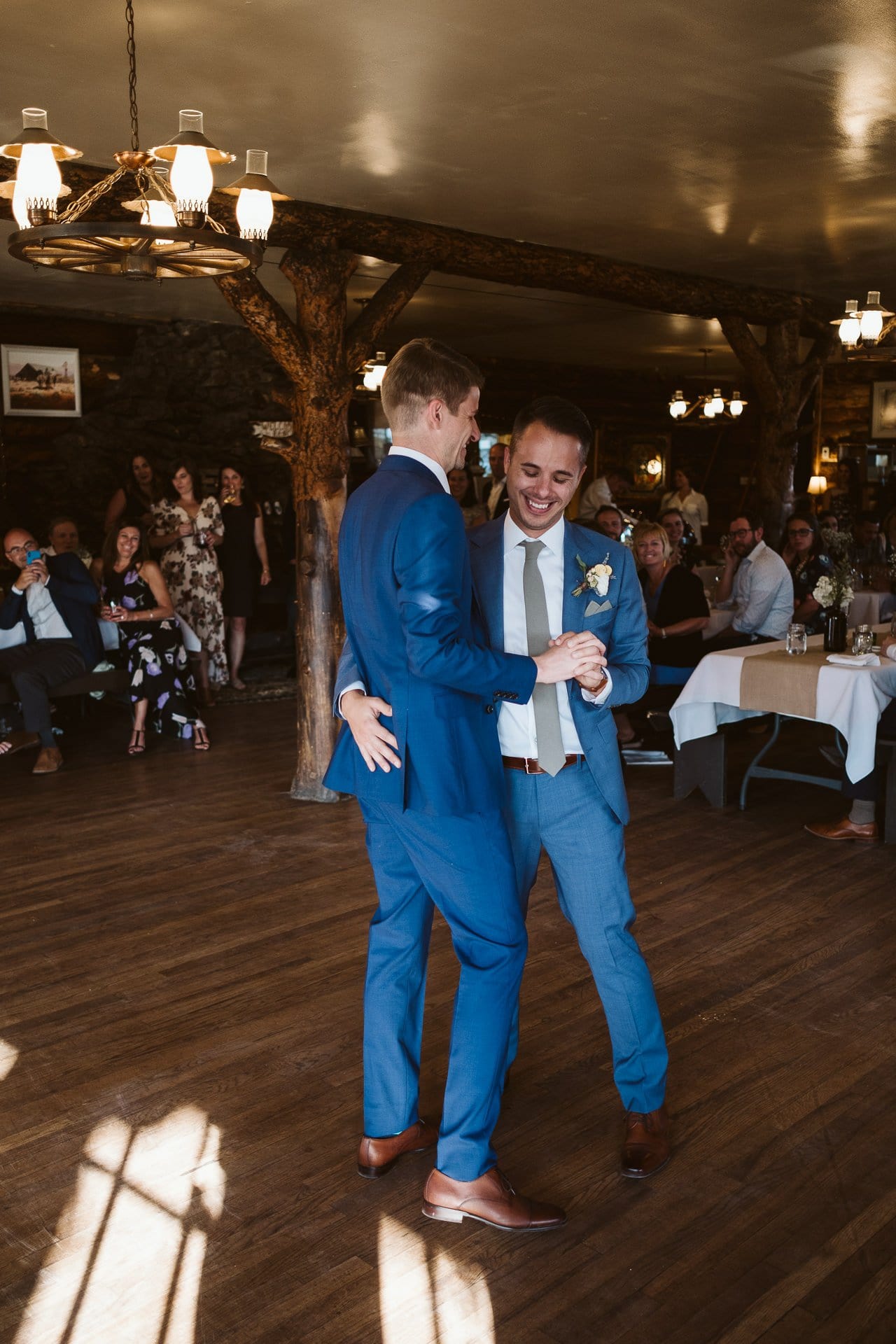 Grooms share first dance at Colorado Mountain Ranch wedding in Boulder