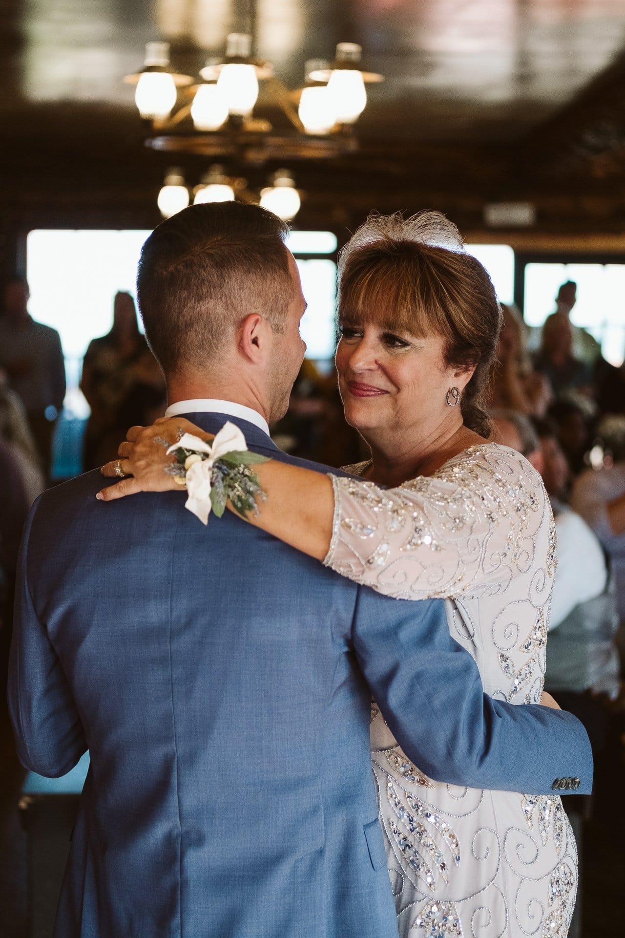 Mother and son dance at wedding at Colorado Mountain Ranch in Boulder