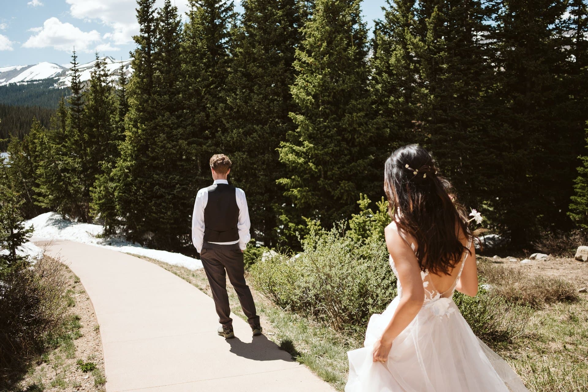 Bride and groom first look in the woods at Brainard Lake outside of Boulder, Colorado hiking elopement photographer