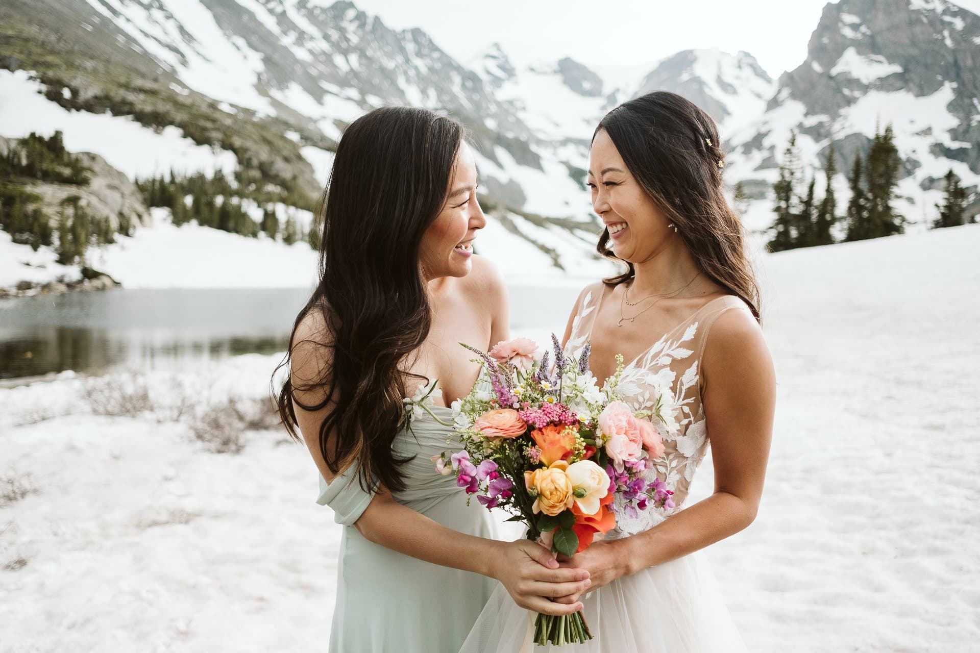 Bride and maid of honor at adventure hiking elopement in the Colorado mountains