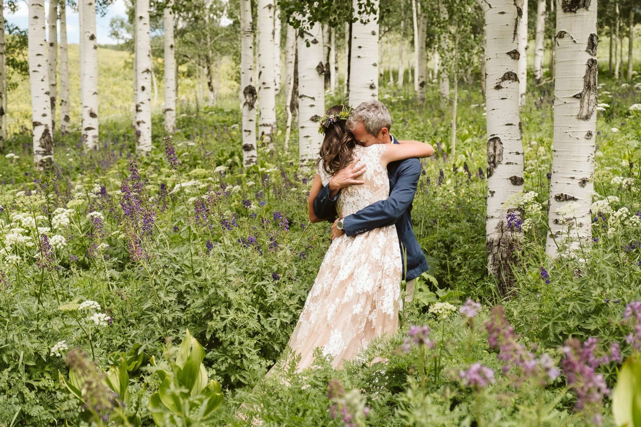 First look in Crested Butte aspen grove with wildflowers, Crested Butte wedding, Colorado wedding photographer