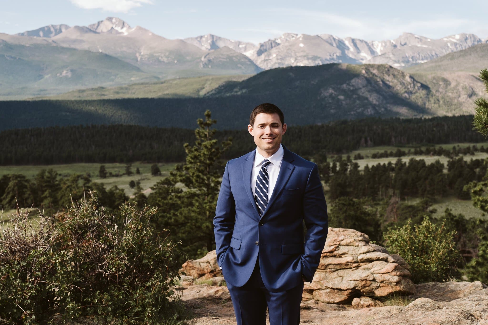 Groom in blue suit for mountain elopement, Colorado groom