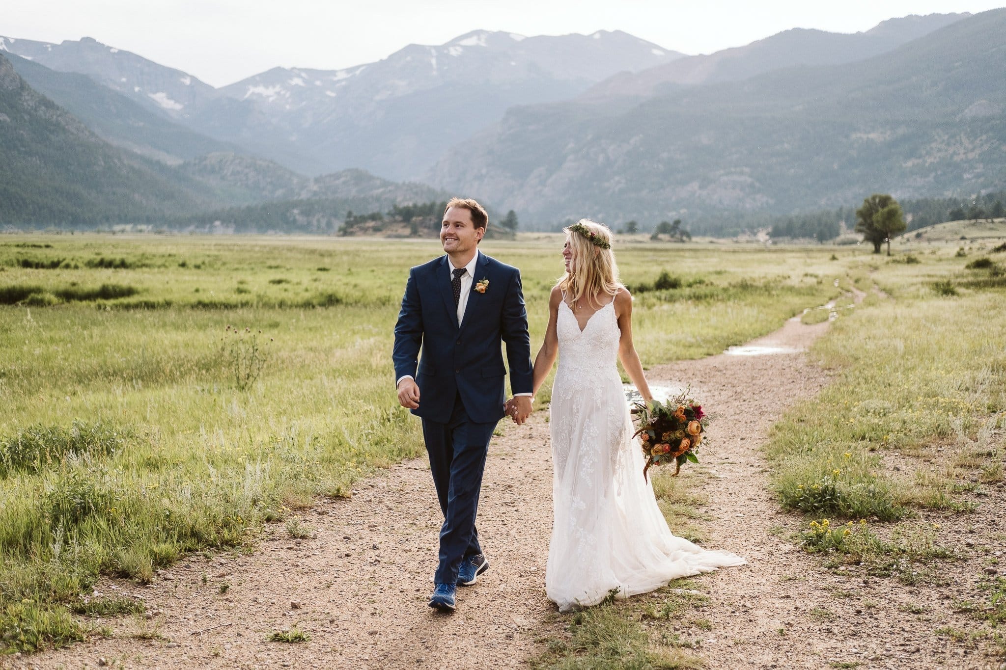 Bride and groom hiking in Moraine Valley for Rocky Mountain National Park elopement, Colorado elopement photographer, adventure elopement