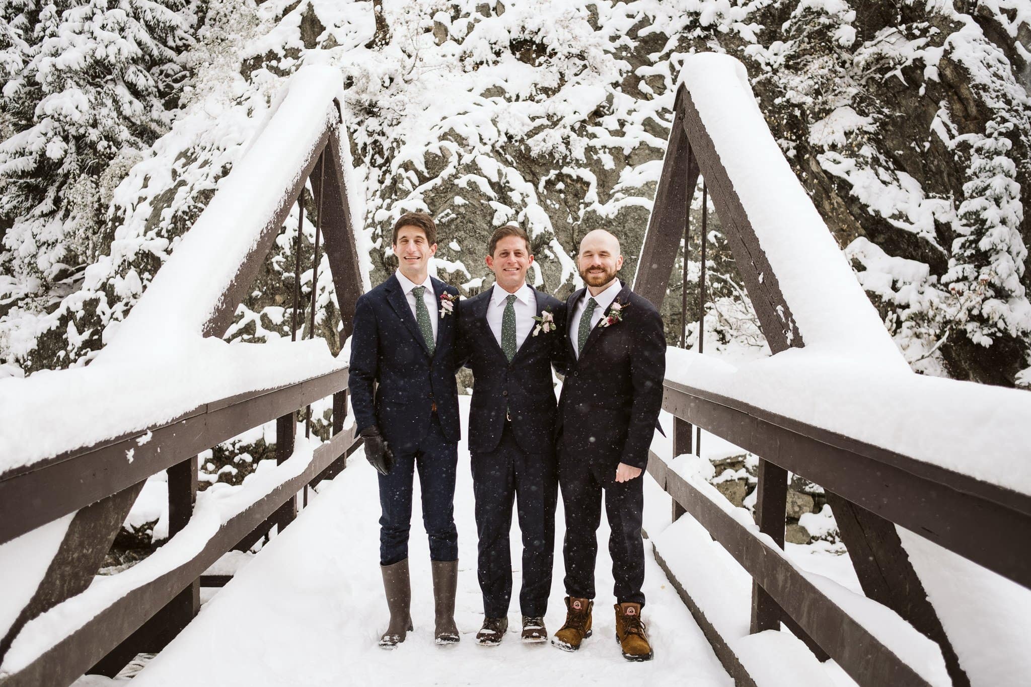 Groom and groomsmen at Fish Creek Falls in Steamboat Springs, Colorado winter elopement