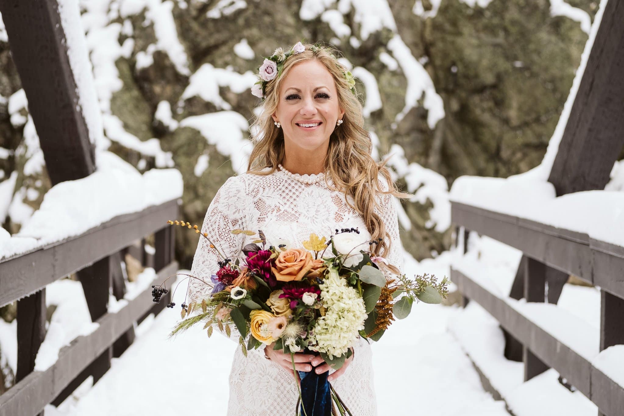 Bridal portraits at Fish Creek Falls in Steamboat Springs, Colorado winter elopement