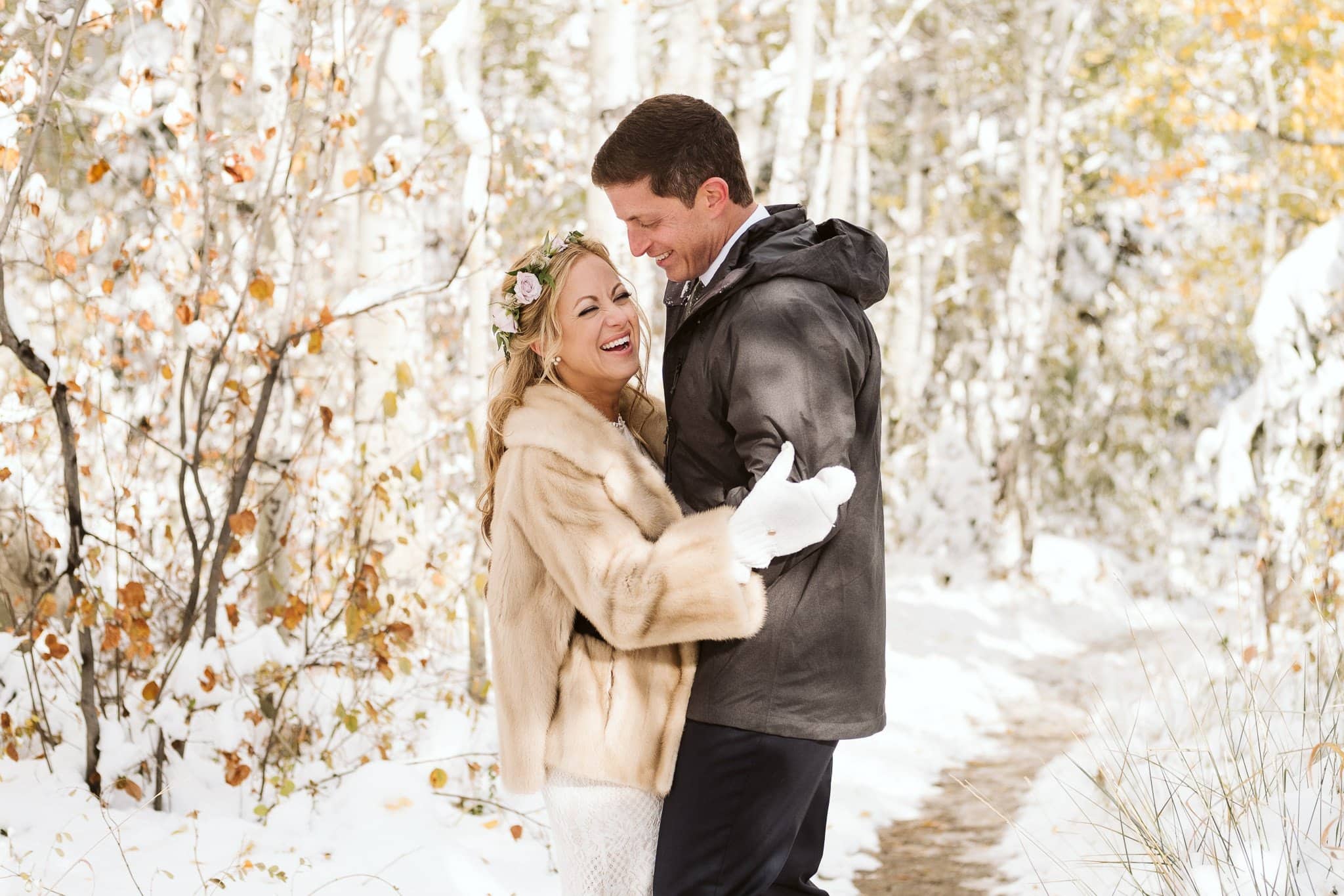 Bride and groom portraits in snow covered aspen trees in Steamboat Springs