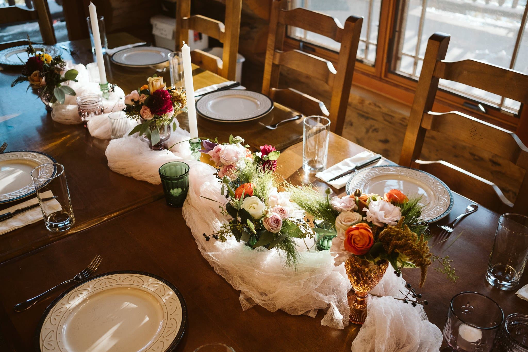 Decorated dining table for intimate elopement reception at private mountain home in the Colorado mountains