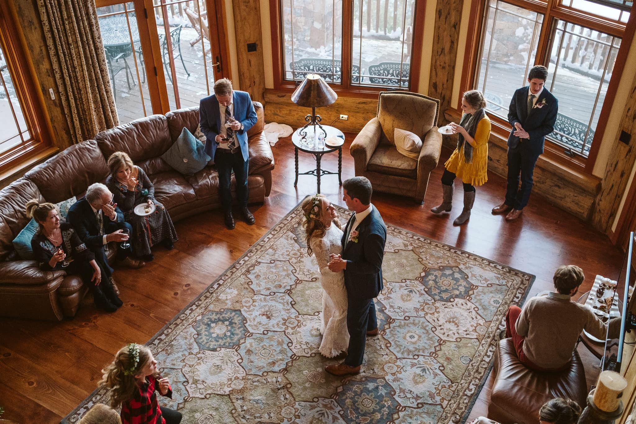 Bride and groom share first dance in the living room of a luxury mountain home in Steamboat Springs, intimate elopement in Colorado