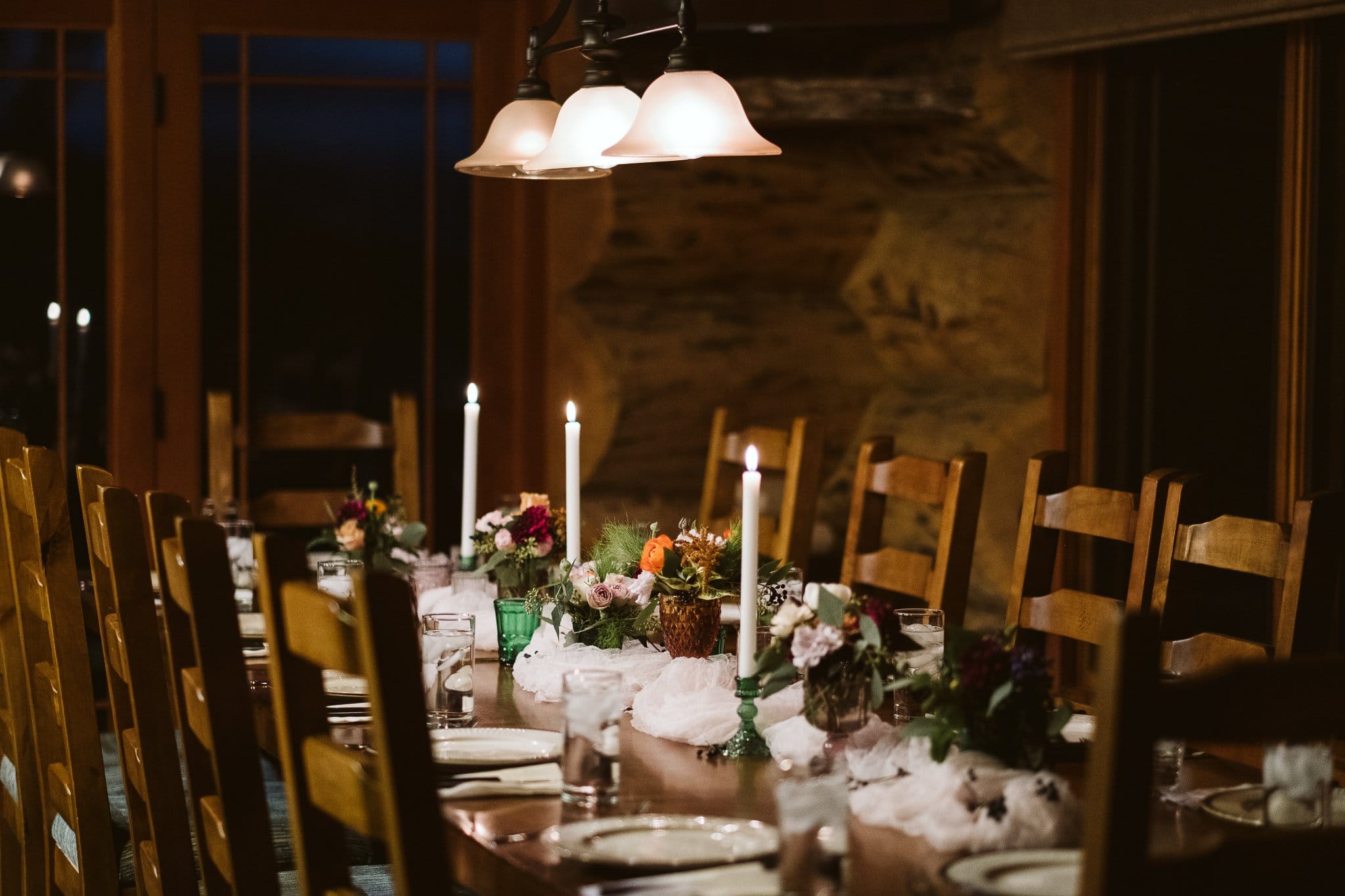 Decorated dining table for intimate elopement reception at private mountain home in the Colorado mountains