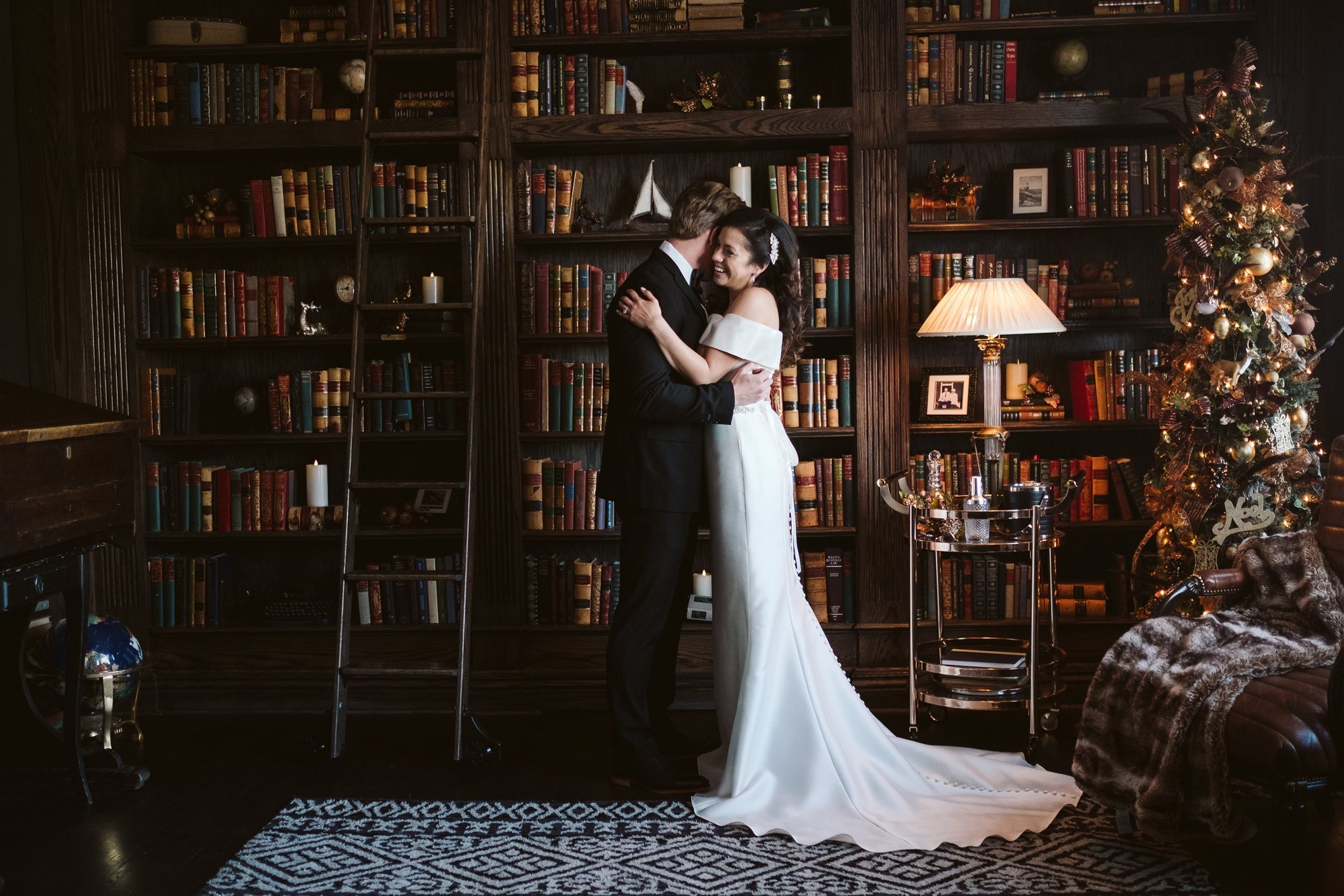 Bride and groom portrait in library at The Manor House wedding