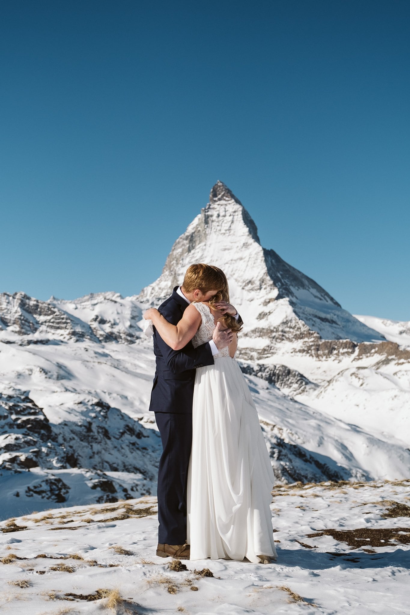 Bride and groom exchange wedding vows in front of Matterhorn in Zermatt. Switzerland elopement photographer.