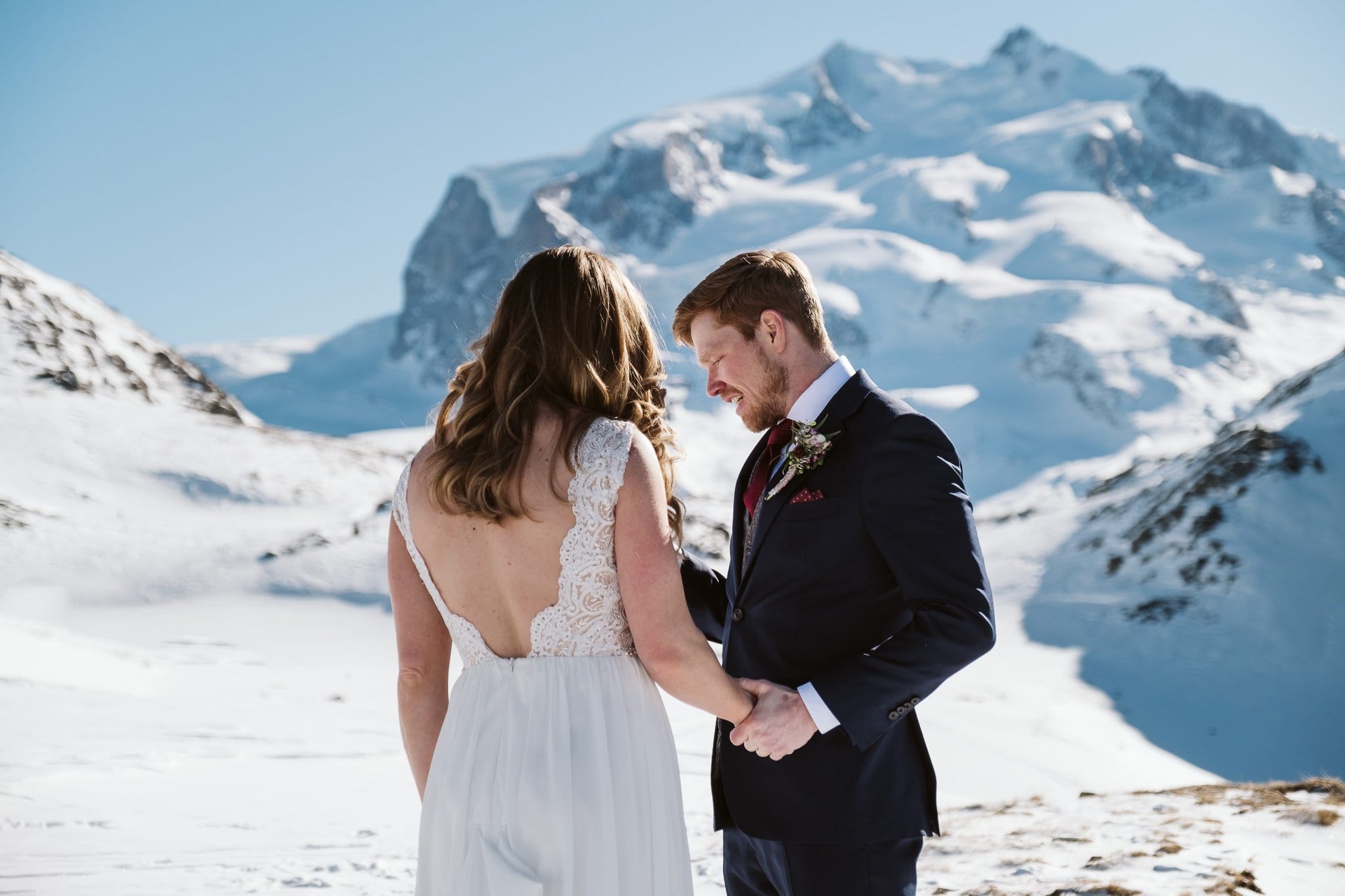 Bride and groom exchange wedding vows in front of Matterhorn in Zermatt. Switzerland elopement photographer.