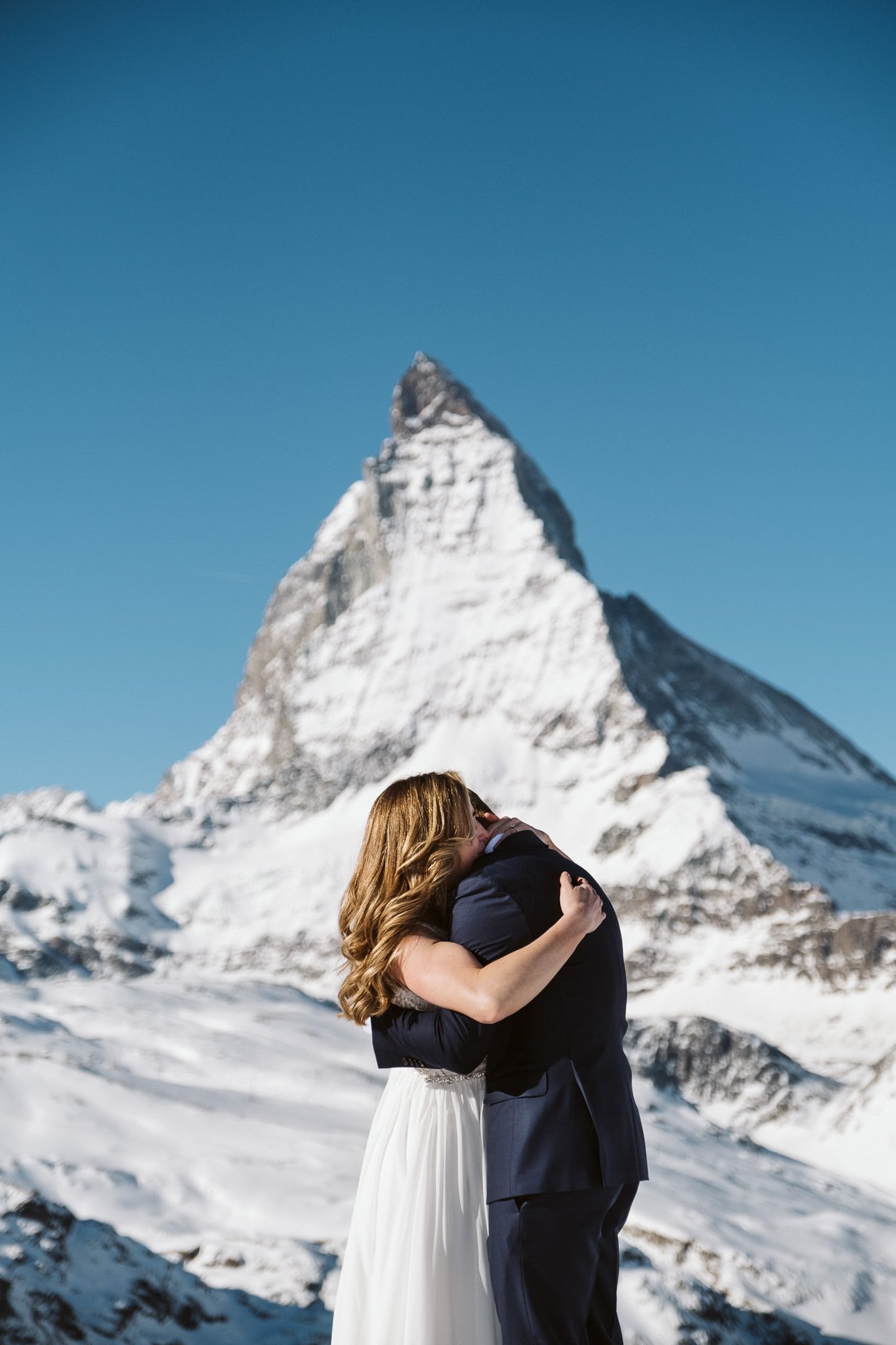 Bride and groom in front of Matterhorn in Zermatt. Switzerland elopement photographer.