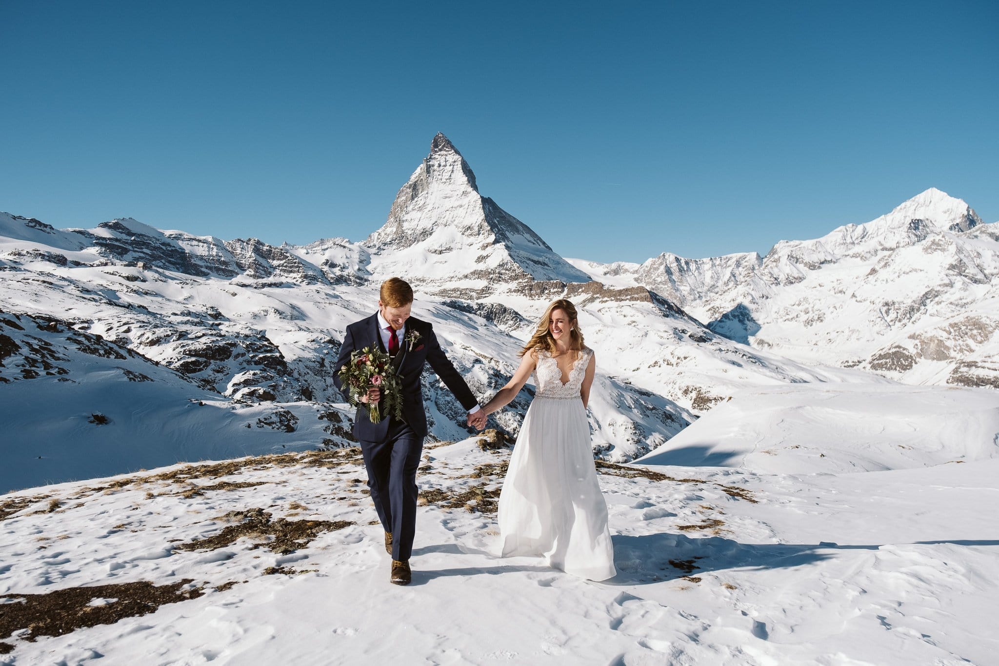 Bride and groom in front of Matterhorn in Zermatt. Switzerland elopement photographer.