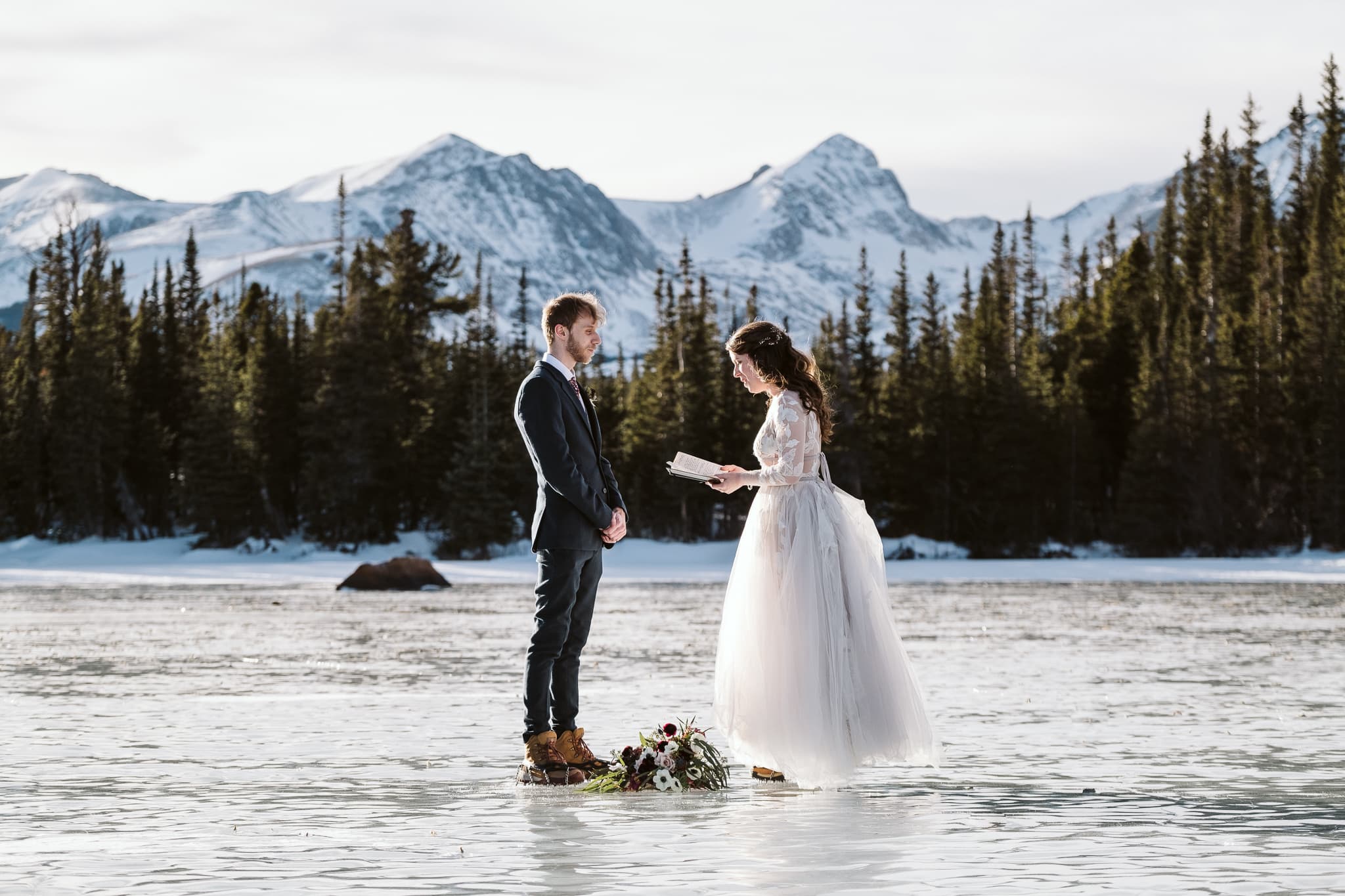 January elopement in Colorado on frozen alpine lake