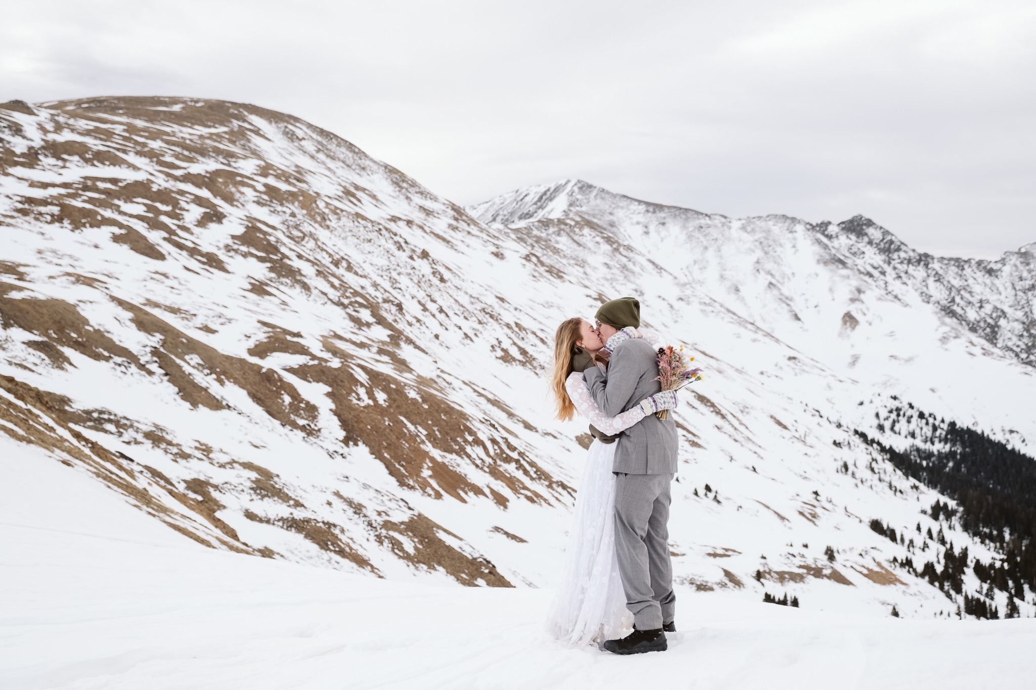 Winter elopement where bride wears wedding dress with long sleeves. 