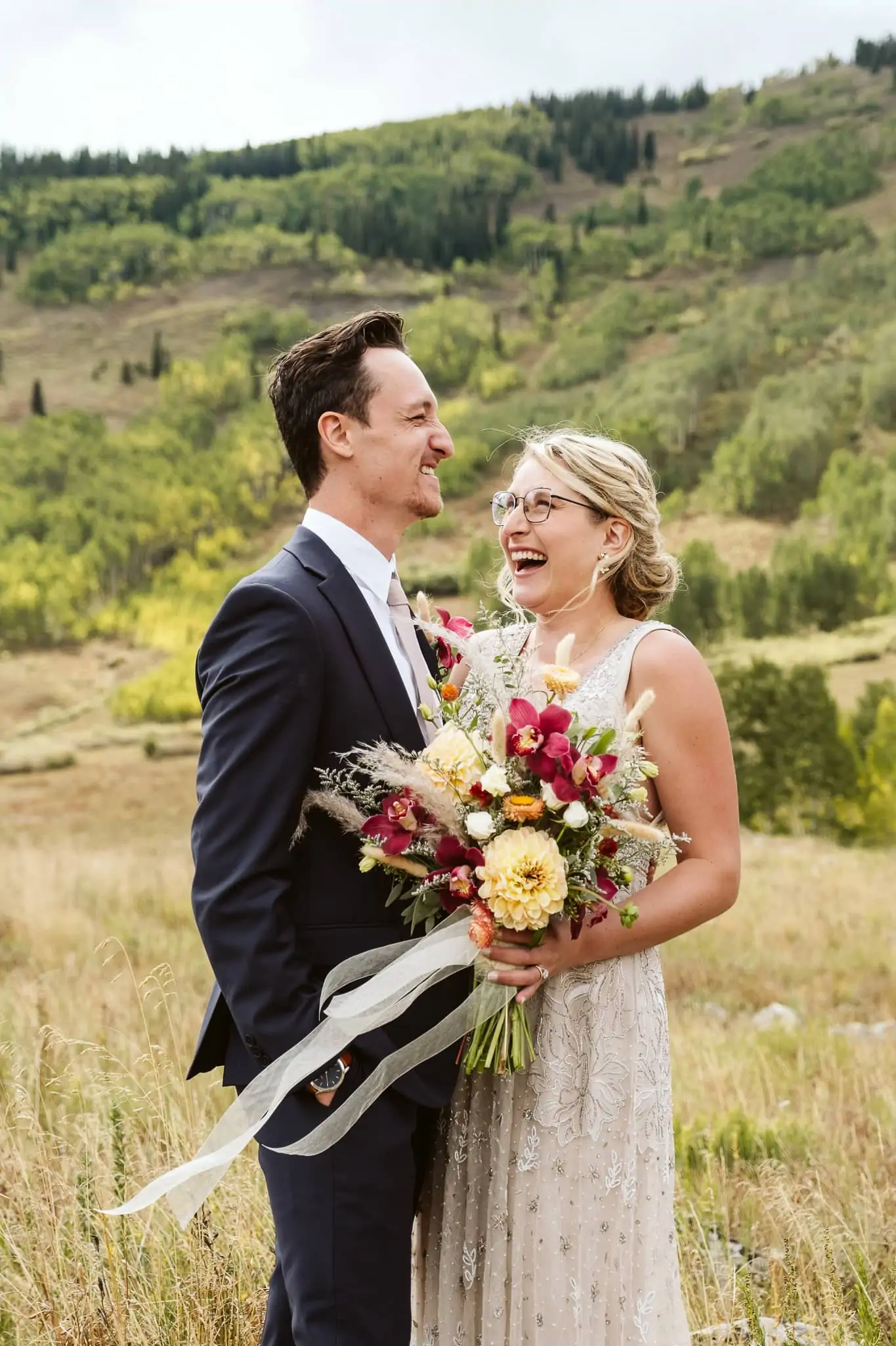 Bride and groom laughing at their elopement in Crested Butte, Colorado