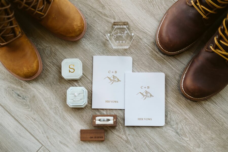 Elopement details with ring box and vow books