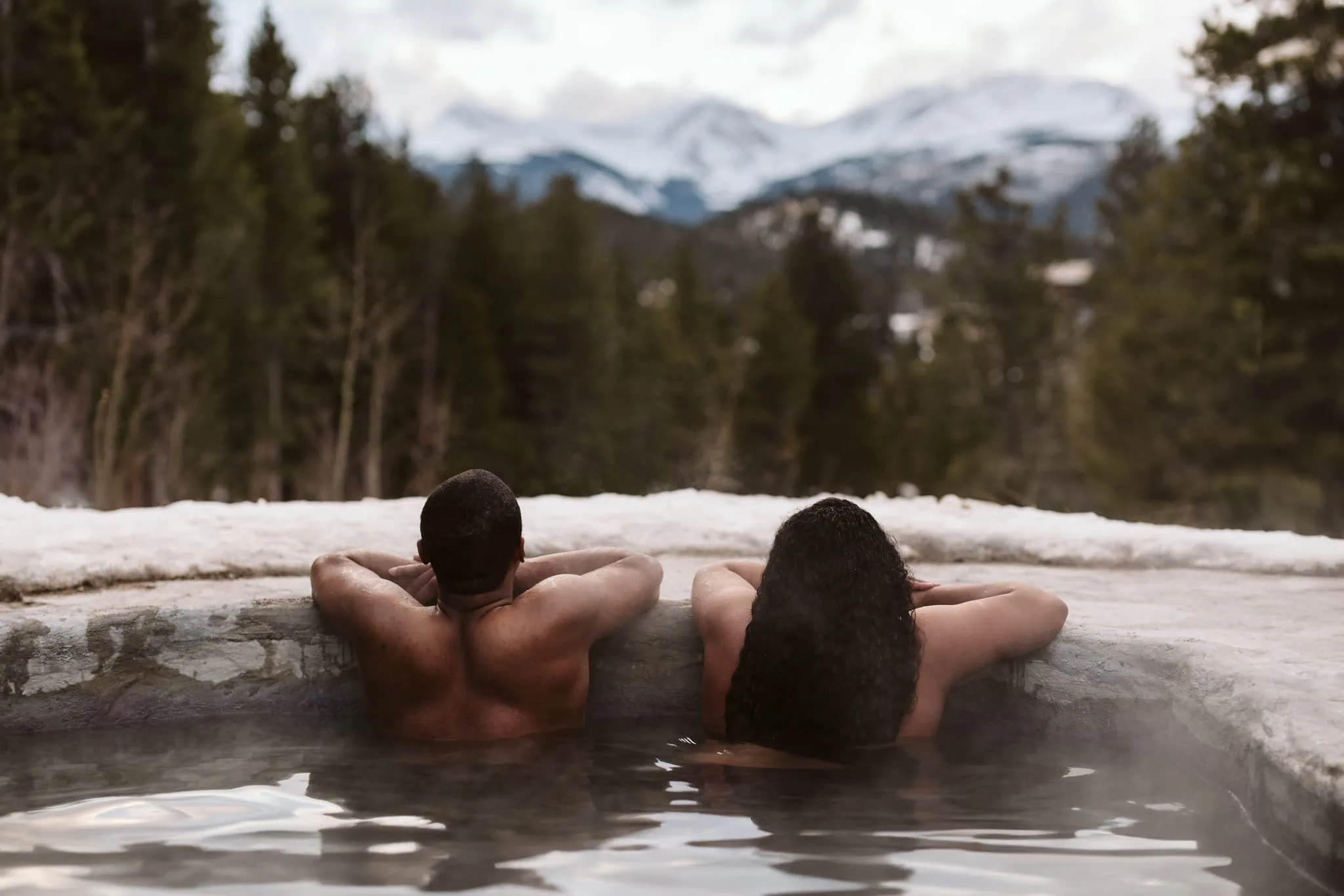Couple enjoys natural hot springs in Colorado on their elopement day